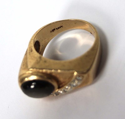Lot 536 - A 14ct yellow gold ring of abstract design set...