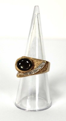 Lot 536 - A 14ct yellow gold ring of abstract design set...
