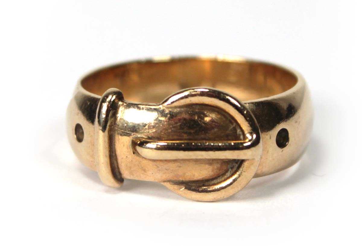 Lot 556 - A 9ct yellow gold buckle ring, London 1971,...