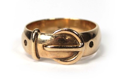 Lot 556 - A 9ct yellow gold buckle ring, London 1971,...