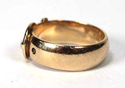 Lot 556 - A 9ct yellow gold buckle ring, London 1971,...