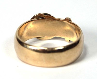 Lot 556 - A 9ct yellow gold buckle ring, London 1971,...
