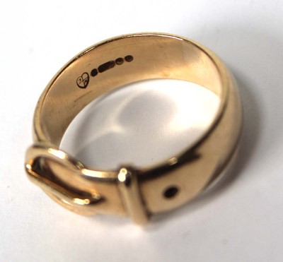 Lot 556 - A 9ct yellow gold buckle ring, London 1971,...