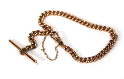Lot 557 - A 9ct rose gold curblink bracelet with t-bar...