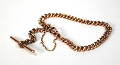 Lot 557 - A 9ct rose gold curblink bracelet with t-bar...