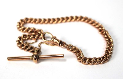 Lot 557 - A 9ct rose gold curblink bracelet with t-bar...
