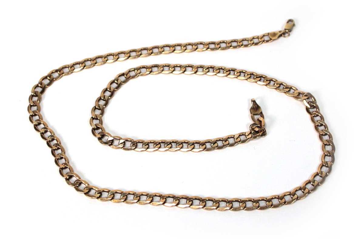 Lot 559 - A 9ct yellow gold flat curblink necklace with...