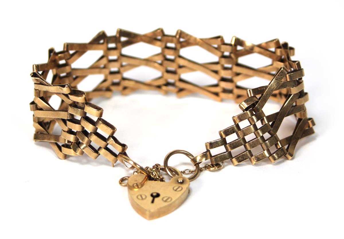 Lot 565 - A 9ct yellow gold three bar gatelink bracelet...