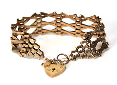 Lot 565 - A 9ct yellow gold three bar gatelink bracelet...
