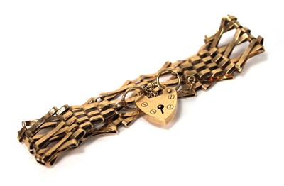 Lot 565 - A 9ct yellow gold three bar gatelink bracelet...