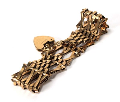 Lot 565 - A 9ct yellow gold three bar gatelink bracelet...