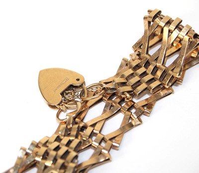 Lot 565 - A 9ct yellow gold three bar gatelink bracelet...