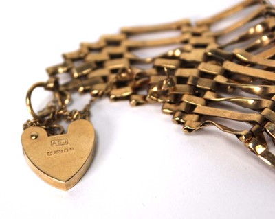Lot 566 - A 9ct yellow gold six bar gatelink bracelet...