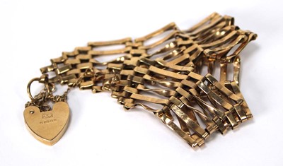 Lot 566 - A 9ct yellow gold six bar gatelink bracelet...