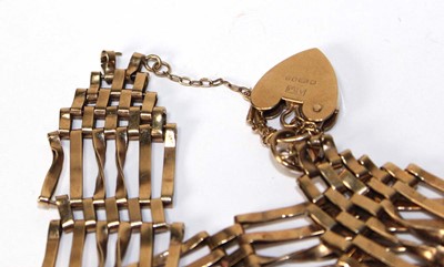 Lot 566 - A 9ct yellow gold six bar gatelink bracelet...