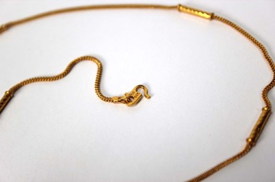 Lot 567 - A Middle Eastern yellow metal multi link...