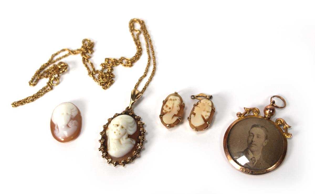 Lot 571 - A yellow metal ropetwist necklace suspending a...
