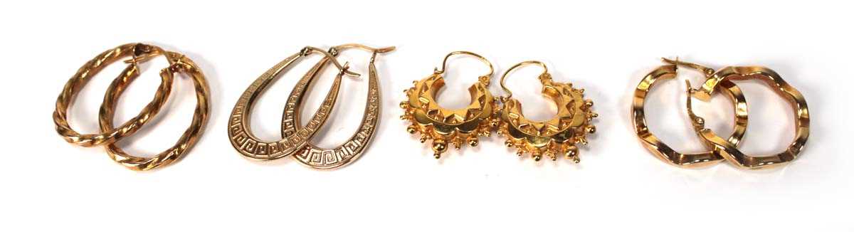 Lot 572 - Four pairs of 9ct yellow gold hoop earrings...