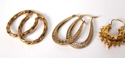 Lot 572 - Four pairs of 9ct yellow gold hoop earrings...