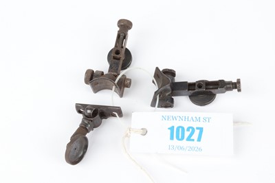 Lot 1027 - Three folding rear peep sights, two by BSA,...