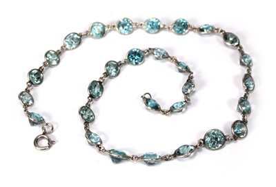 Lot 576 - A silver necklace suspending twenty-nine round...