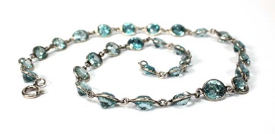 Lot 576 - A silver necklace suspending twenty-nine round...