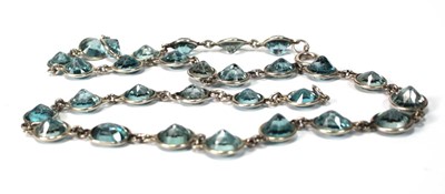 Lot 576 - A silver necklace suspending twenty-nine round...