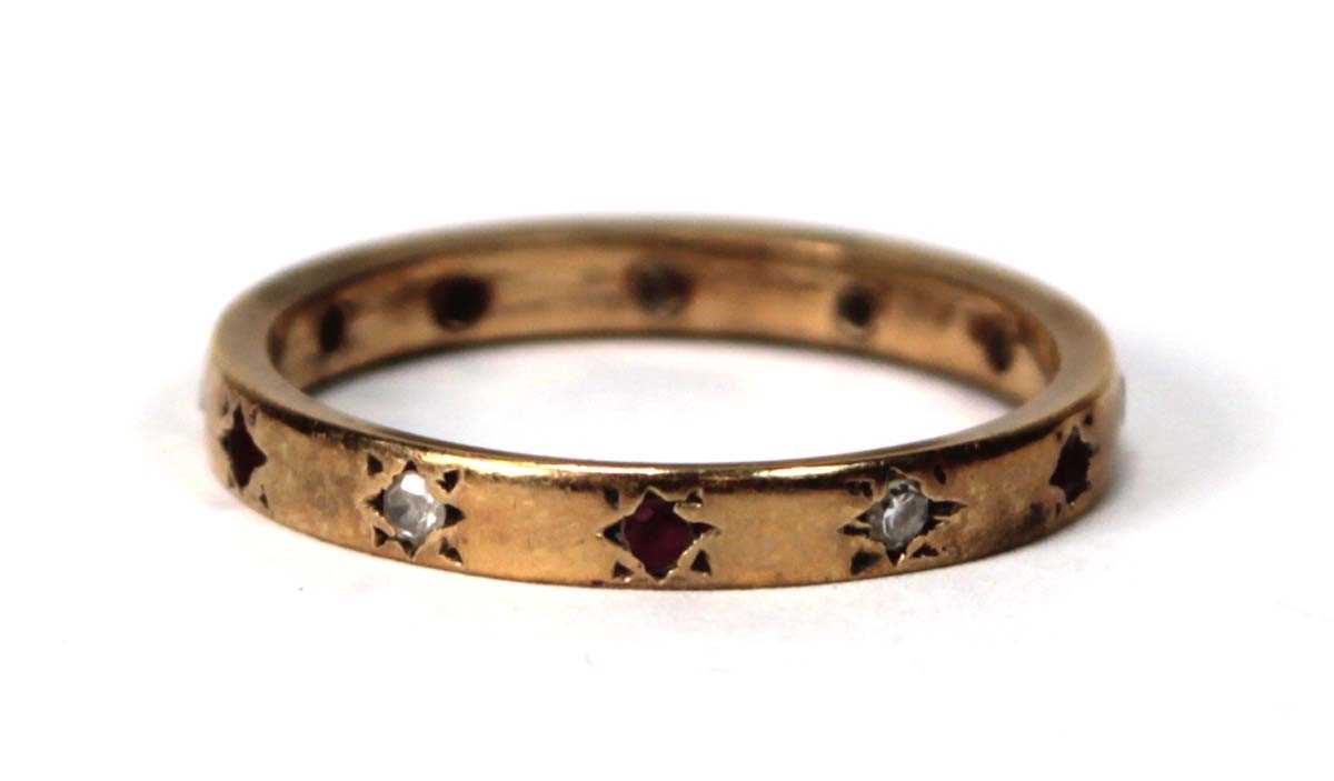 Lot 580 - A yellow metal band ring set six small...