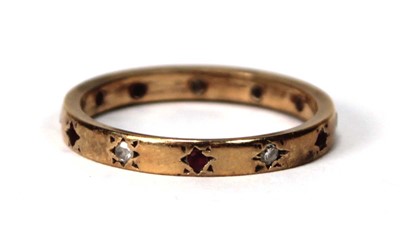 Lot 580 - A yellow metal band ring set six small...