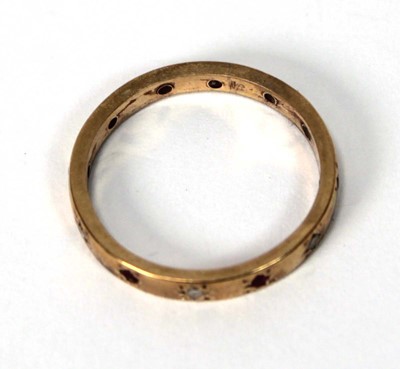 Lot 580 - A yellow metal band ring set six small...