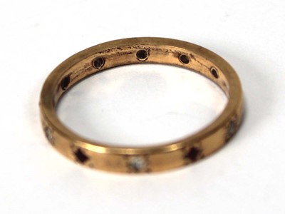 Lot 580 - A yellow metal band ring set six small...