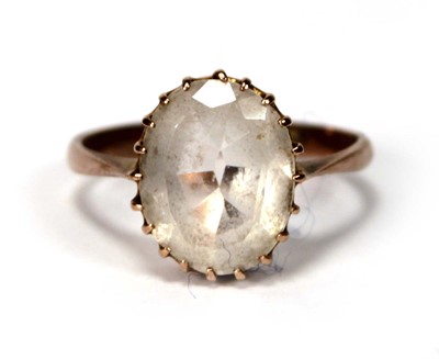 Lot 581 - A 9ct yellow gold ring set oval quartz type...