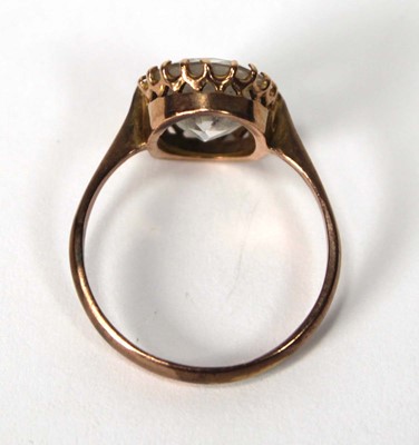Lot 581 - A 9ct yellow gold ring set oval quartz type...