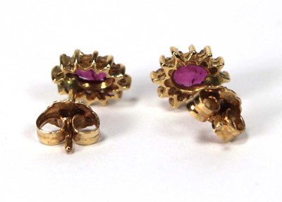 Lot 582 - A pair of 14ct yellow gold ear studs, each set...