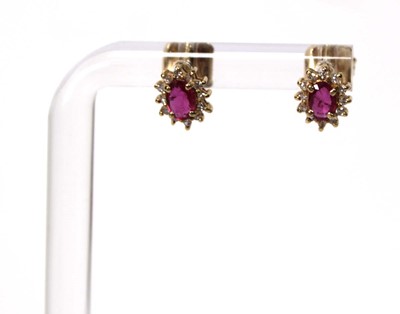 Lot 582 - A pair of 14ct yellow gold ear studs, each set...