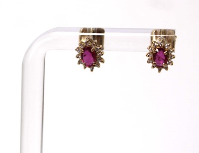 Lot 582 - A pair of 14ct yellow gold ear studs, each set...