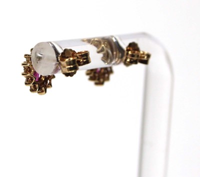 Lot 582 - A pair of 14ct yellow gold ear studs, each set...