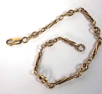 Lot 583 - A 9ct yellow gold fancy link bracelet with...