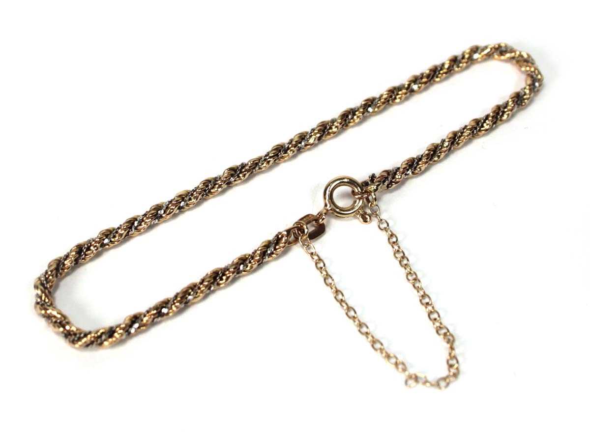 Lot 584 - A 9ct two-colour gold ropetwist bracelet, l....