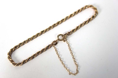 Lot 584 - A 9ct two-colour gold ropetwist bracelet, l....