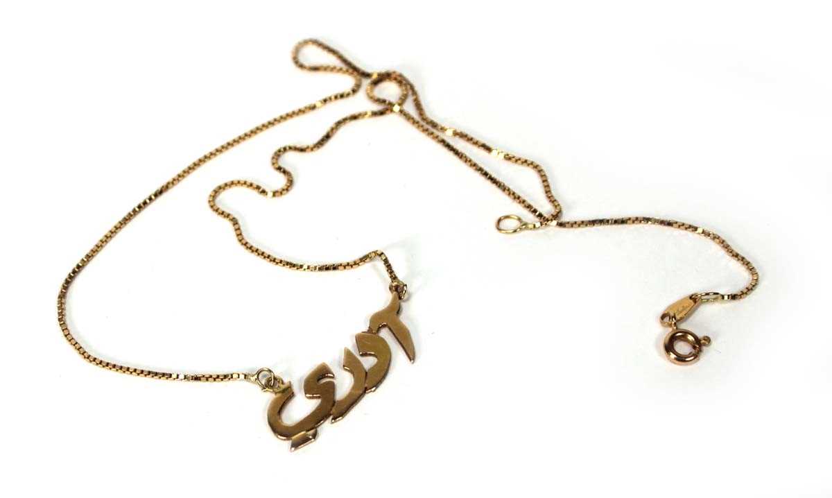 Lot 585 - A yellow metal boxlink necklace suspending a...