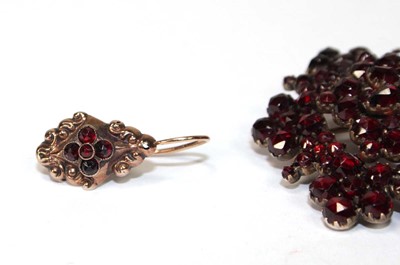 Lot 590 - A pair of yellow metal ear pendants of...