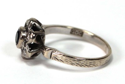 Lot 591 - An 18ct white gold cluster ring set small...