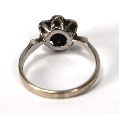 Lot 591 - An 18ct white gold cluster ring set small...