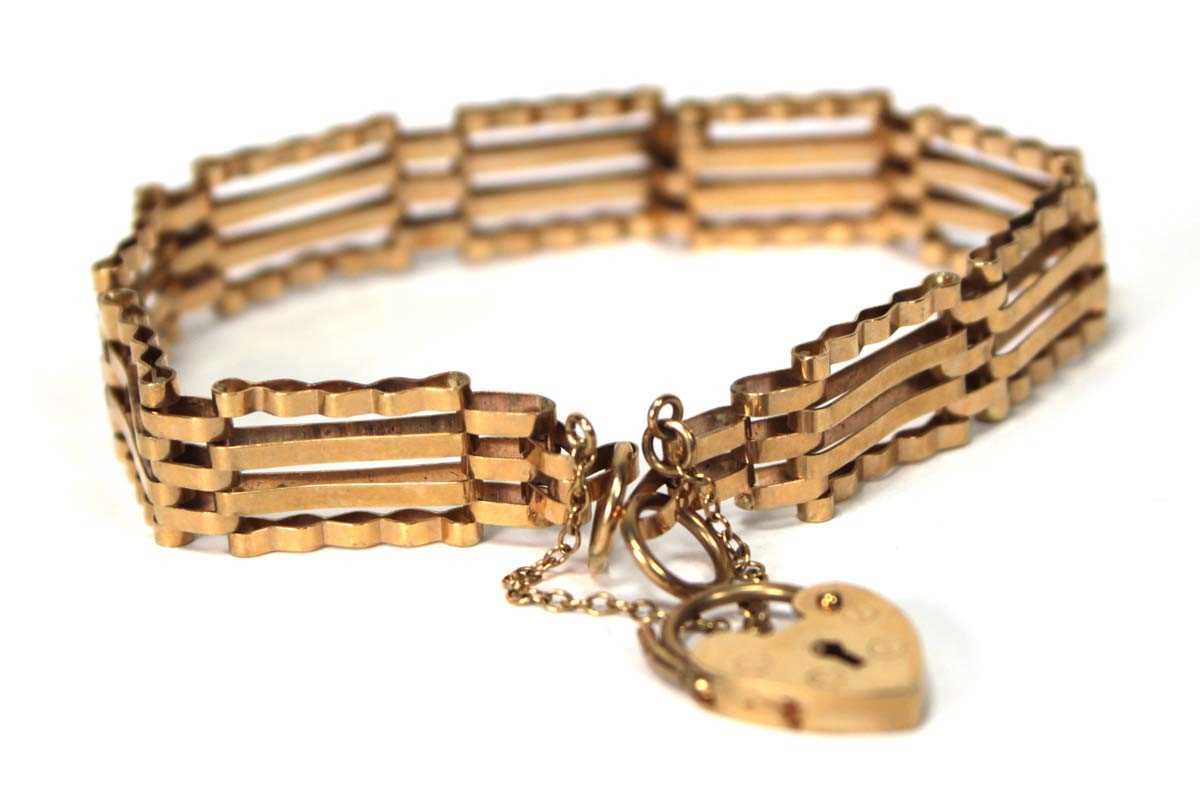 Lot 593 - A 9ct yellow gold four bar gatelink bracelet...