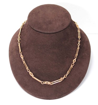 Lot 595 - A rose/yellow gold fancy link necklace with...