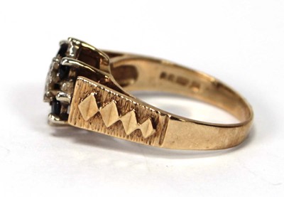 Lot 599 - A 9ct yellow gold cluster ring set four small...