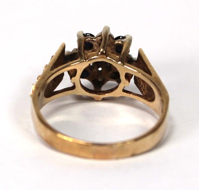 Lot 599 - A 9ct yellow gold cluster ring set four small...