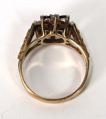 Lot 599 - A 9ct yellow gold cluster ring set four small...