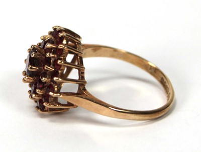 Lot 600 - A 9ct yellow gold cluster ring set three tiers...